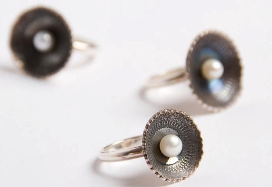 Oxidised silver cup rings each set with a pearl