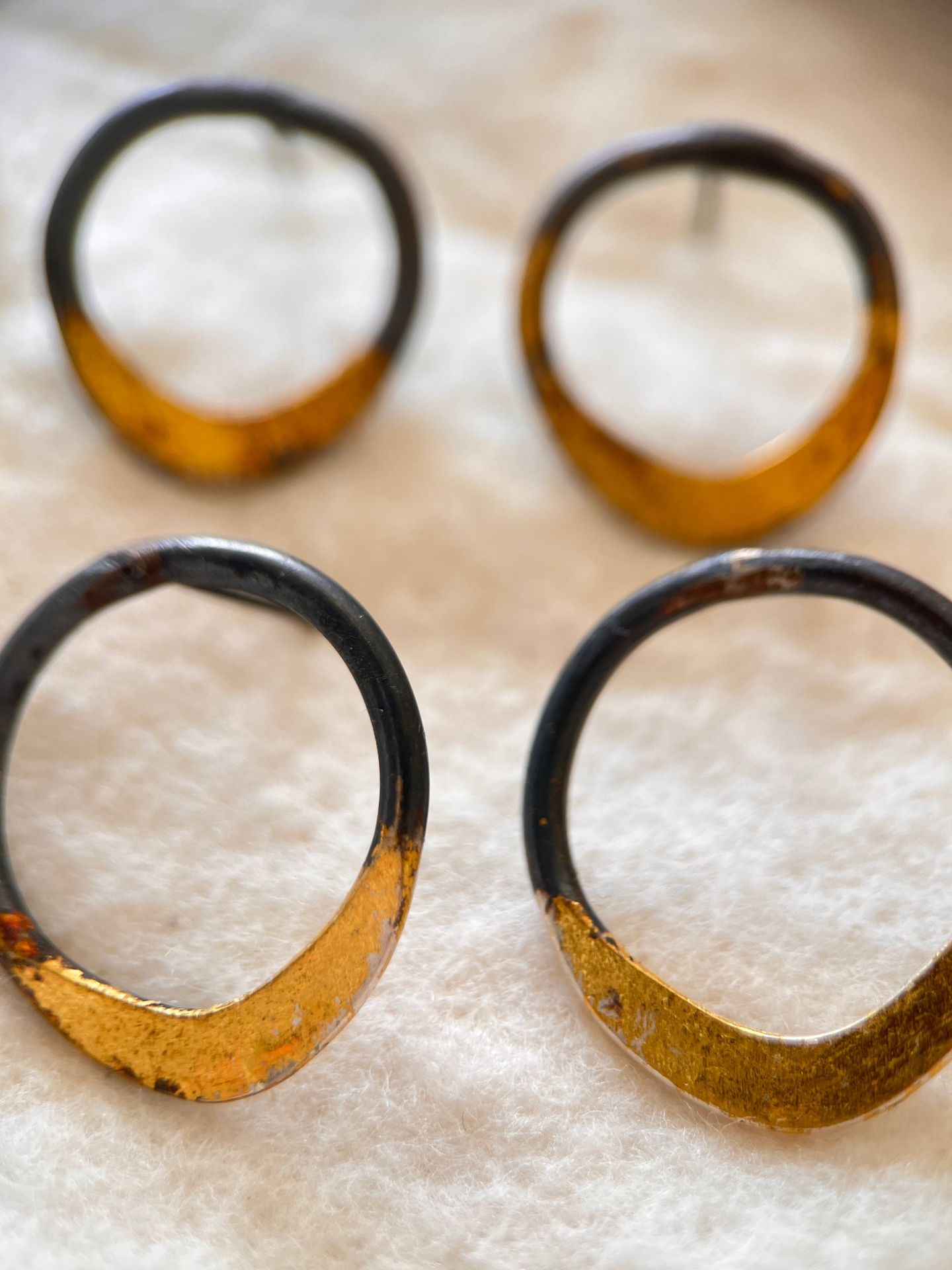 Oxidised silver hoop earrings, gilded along the lower edge