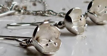 Silver flower drop earrings
